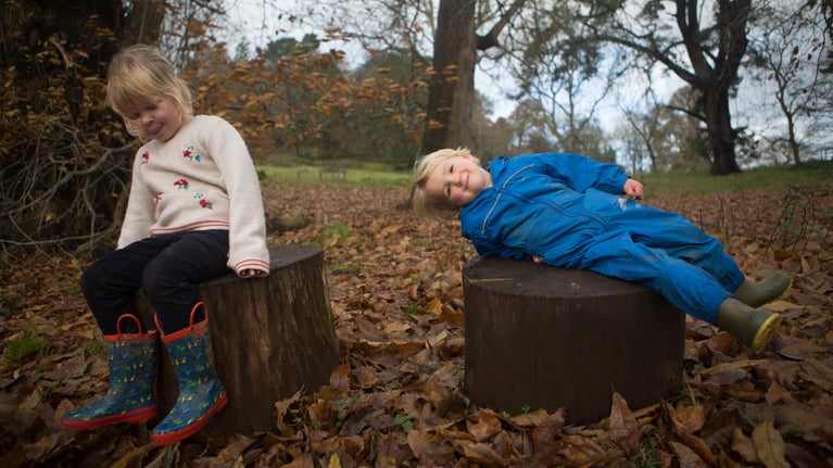 Children playing in the garden in November at Killerton, Devon